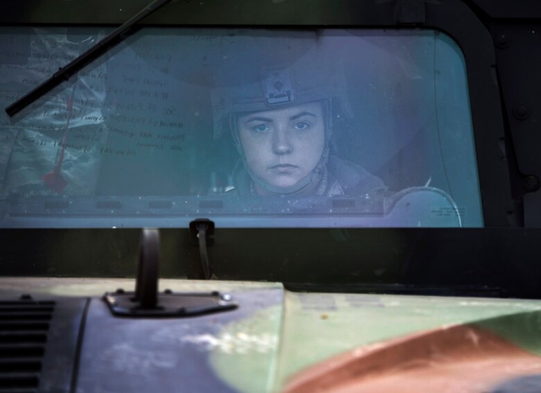 Airman 1st Class Alexis Dinger, 366th Security Forces Squadron response force leader, leads the convoy down Perimeter Road Nov. 5, 2015 at Mountain Home AFB, Idaho. As Dinger drove through the area, she took notes on the front windshield of information to pass on to her unit leader and the other vehicles behind her. (U.S. Air Force photo by Airman 1st Class Jeremy L. Mosier/Released)