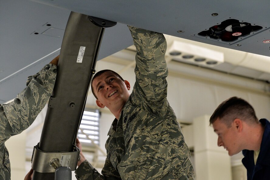 Tech Sgt. Daren Detachment 13 operation location A instructor pulls bold to place landing gear back in place at Creech Air Force Base, Nevada. Nov. 6, 2015. Det 13 OL-A provides maintenance training to the MQ-1/9 enterprise. Crew Chiefs, Avionics, Weapons and Communications courses are offered from our staff of 6 AETC instructors.