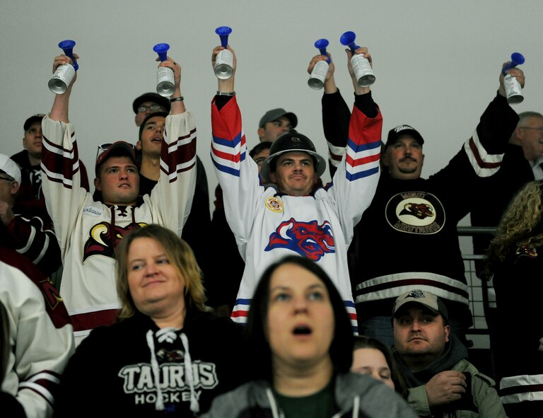 Fans blow horns during a Minot Minotauros game against the Bismarck Bobcats in Minot, N.D. Nov. 10, 2015. The game honored military veterans for Veteran’s Day. (U.S. Air Force photo by Staff Sgt. Chad Trujillo)