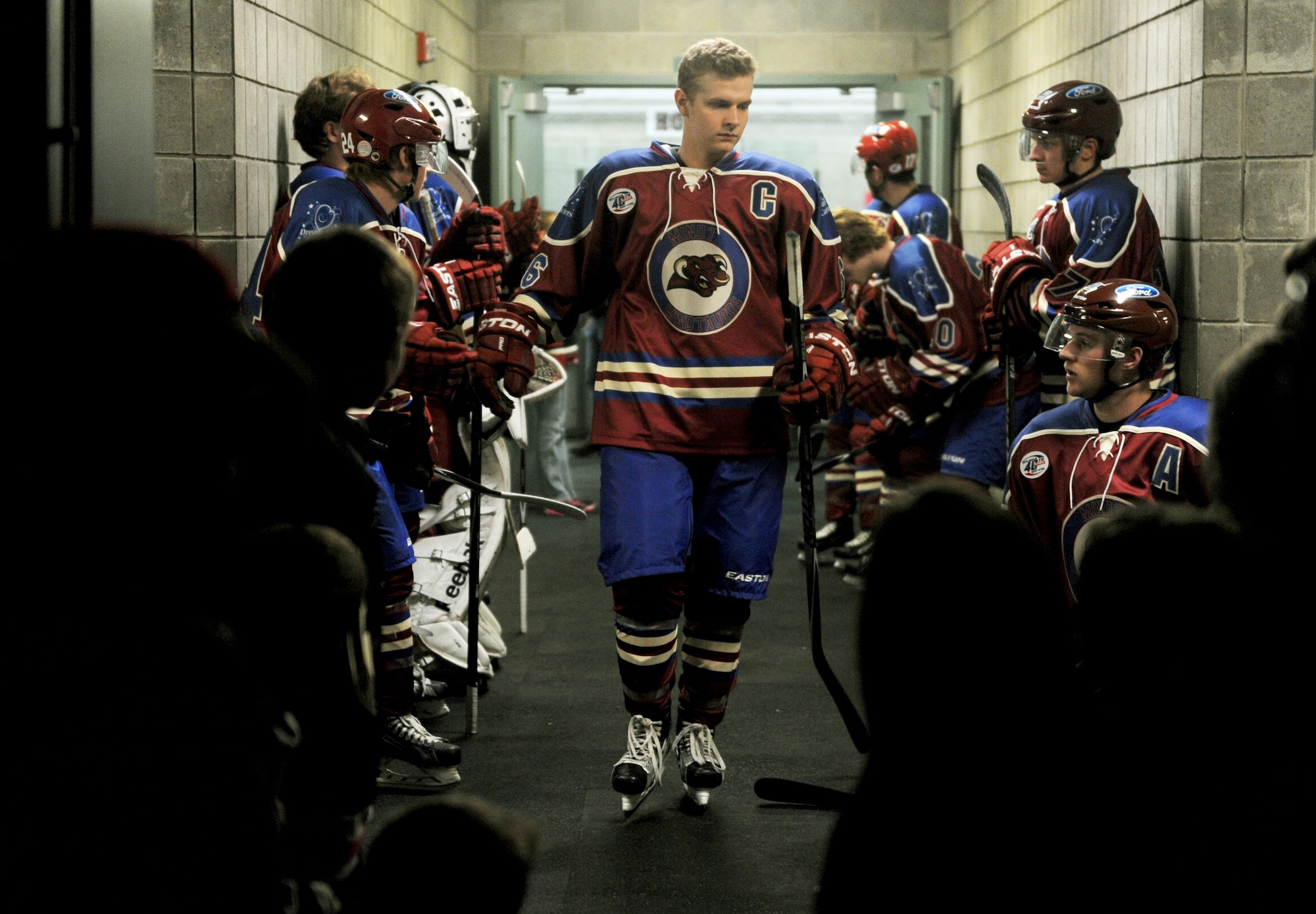 The Minot Minotauros team stand in a hallway right before they played against the Bismarck Bobcats in Minot, N.D. Nov. 10, 2015. The game was honored military veterans for Veteran’s Day. (U.S. Air Force photo by Staff Sgt. Chad Trujillo)
