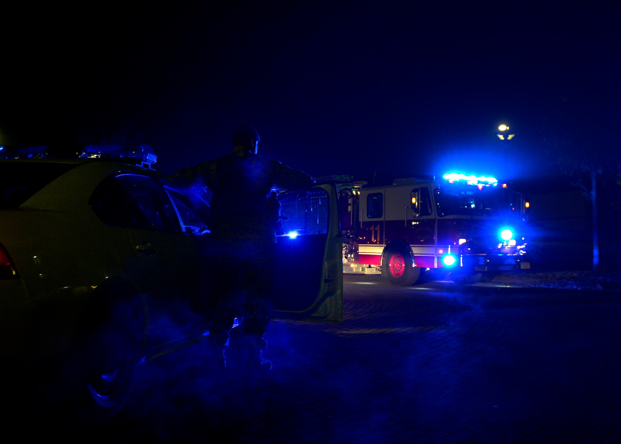 U.S. Air Force defenders arrive on scene as 31st Civil Engineer Squadron firefighters respond to a smoke alarm, Nov. 9, 2015, at Aviano Air Base, Italy. Firefighters receive more than 13 weeks of technical school instruction before arriving at Aviano Air Base to begin on-the-job training, which can last more than a year. (U.S. photo by Airman 1st Class Cary Smith/Released)