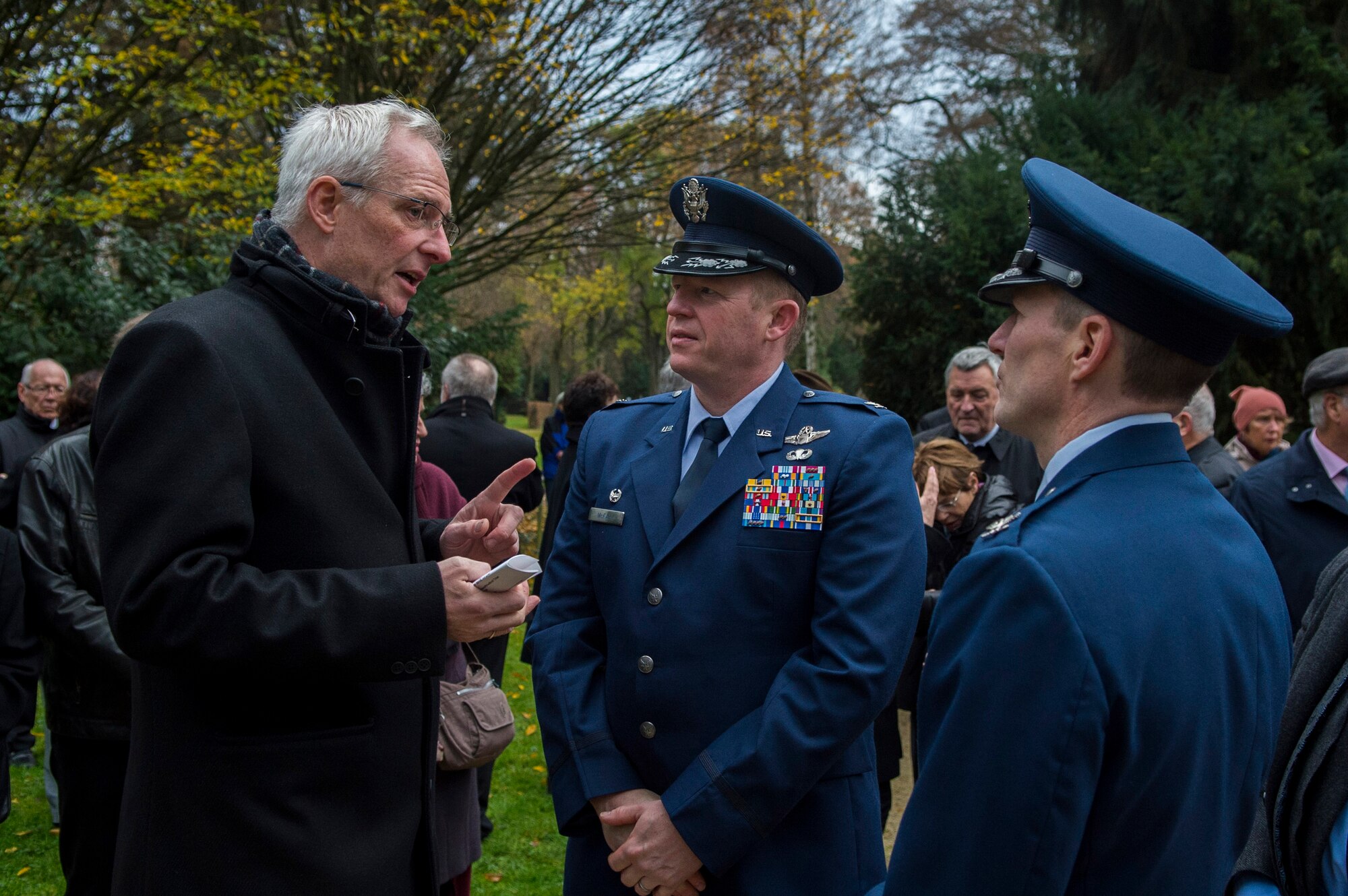Wolfram Leibe, mayor of Trier, left, speaks with U.S. Air Force Col. Joe McFall, 52nd Fighter Wing commander, center, and U.S. Air Force Col. Steve Horton, 52nd FW vice commander during a National Mourning Day ceremony at a cemetery in Trier, Germany, Nov. 15, 2015. Leibe gave a speech during the ceremony addressing the importance of the day. (U.S. Air Force photo by Airman 1st Class Luke Kitterman/Released)