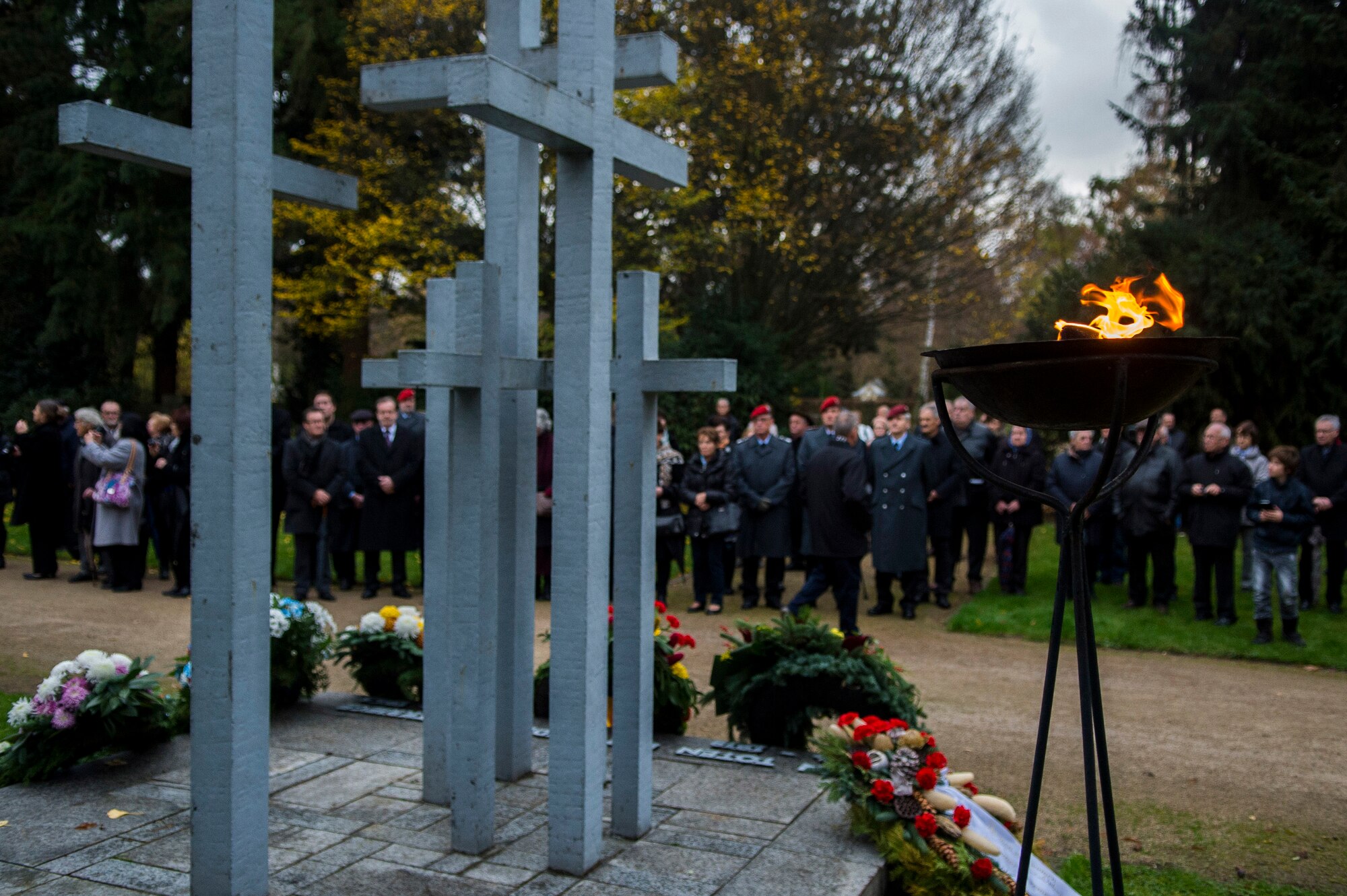 A German memorial faces a crowd during a National Mourning Day ceremony at a cemetery in Trier, Germany, Nov. 15, 2015. The memorial was the location of a ceremony for Germany’s National Mourning Day. (U.S. Air Force photo by Airman 1st Class Luke Kitterman/Released)