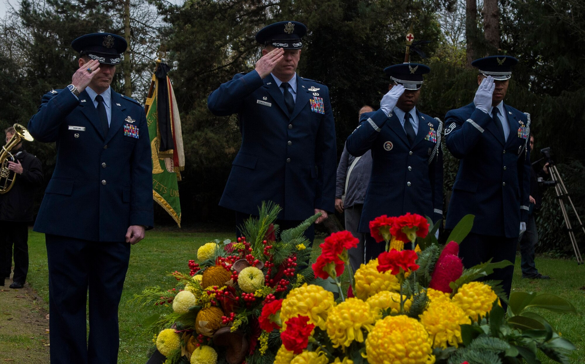 Spangdahlem Airmen salute after laying a wreath during a National Mourning Day ceremony at a cemetery in Trier, Germany, Nov. 15, 2015. Germany’s National Mourning Day is day for mourning the victims of the two world wars, those who lost their lives during current operations, and ones still missing in action. (U.S. Air Force photo by Airman 1st Class Luke Kitterman/Released)