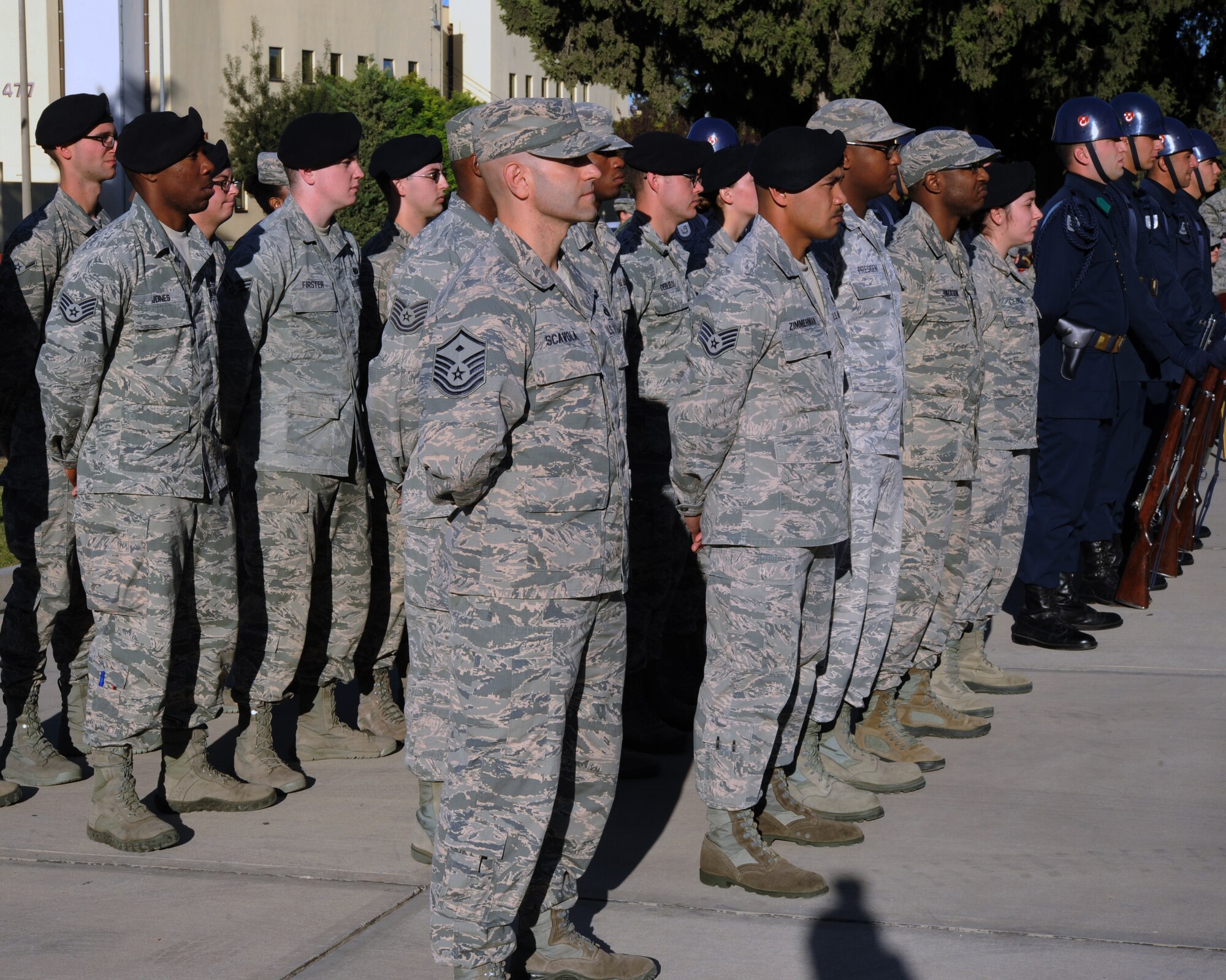 U.S. and Turkish Airmen stand at parade rest during a Veterans Day ceremony Nov. 11, 2015, at Incirlik Air Base, Turkey. Veterans Day is a U.S. federal holiday to honor military veterans who have served in the U.S. Armed Forces. (U.S. Air Force photo by Airman 1st Class Daniel Lile/Released)