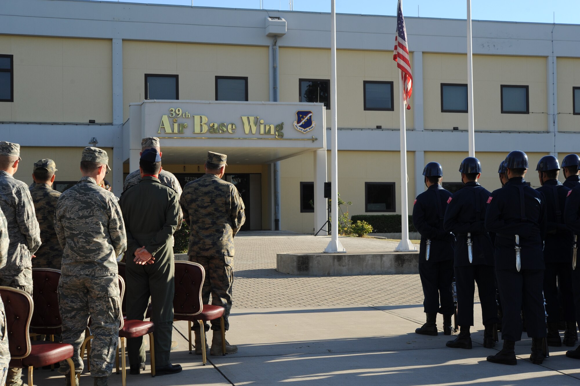 U.S. and Turkish Airmen partner together at the 39th Air Base Wing flagpole for a Veterans Day ceremony Nov. 11, 2015, at Incirlik Air Base, Turkey. The ceremony included remarks by Col. John Walker, 39th ABW commander, and the playing of taps to honor the fallen. (U.S. Air Force photo by Airman 1st Class Daniel Lile/Released)