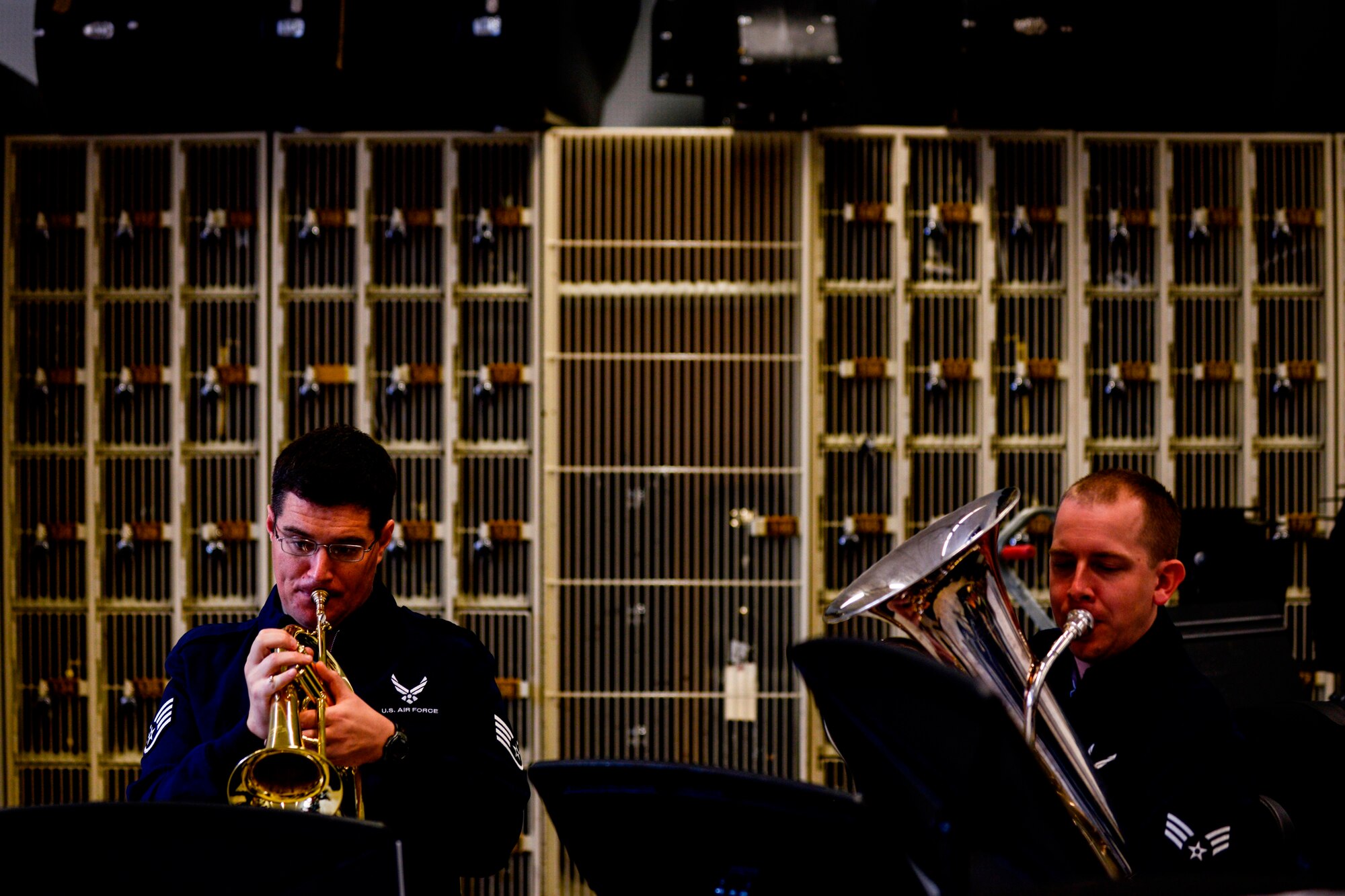 Staff Sgt. Will McCrary and Senior Airman Travis Hyde, both U.S. Air Forces in Europe Band’s Five Star Brass Quintet musicians, perform for Kaiserslautern High School students Nov. 5, 2015, on Vogelweh Military Complex.  School performances help the Air Force to reach out to students and help spread music that creates bonds with partnered nations. (U.S Air Force photo/Senior Airman Nicole Sikorski)