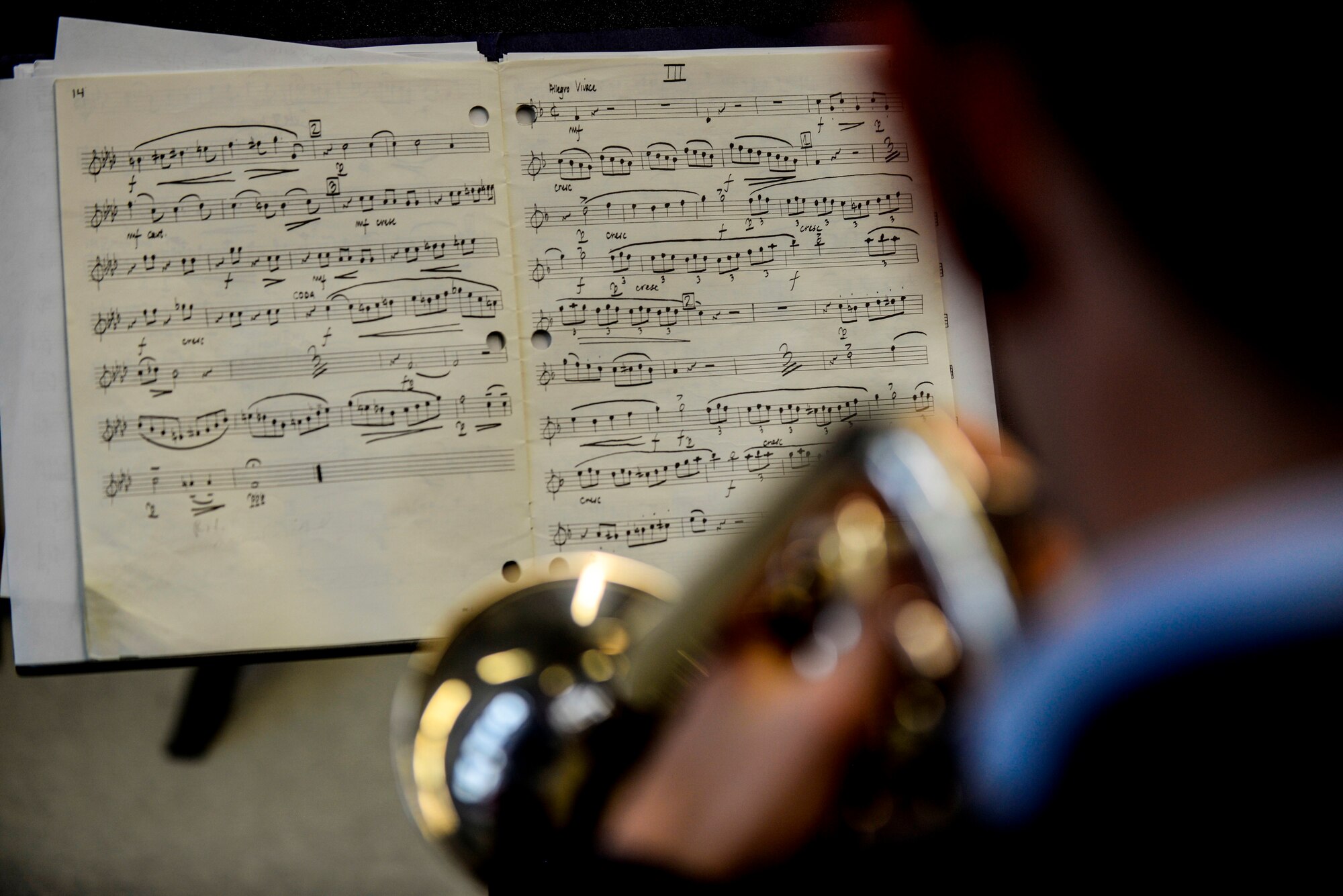 Sheets of music are placed on a stand during a performance by U.S. Air Forces in Europe Band’s Five Star Brass Quintet Nov. 5, 2015, at Kaiserslautern High School.  School performances are just one way that the USAFE band strengthens partnerships with the local community as well as laying a foundation for future young musicians. (U.S Air Force photo/Senior Airman Nicole Sikorski)