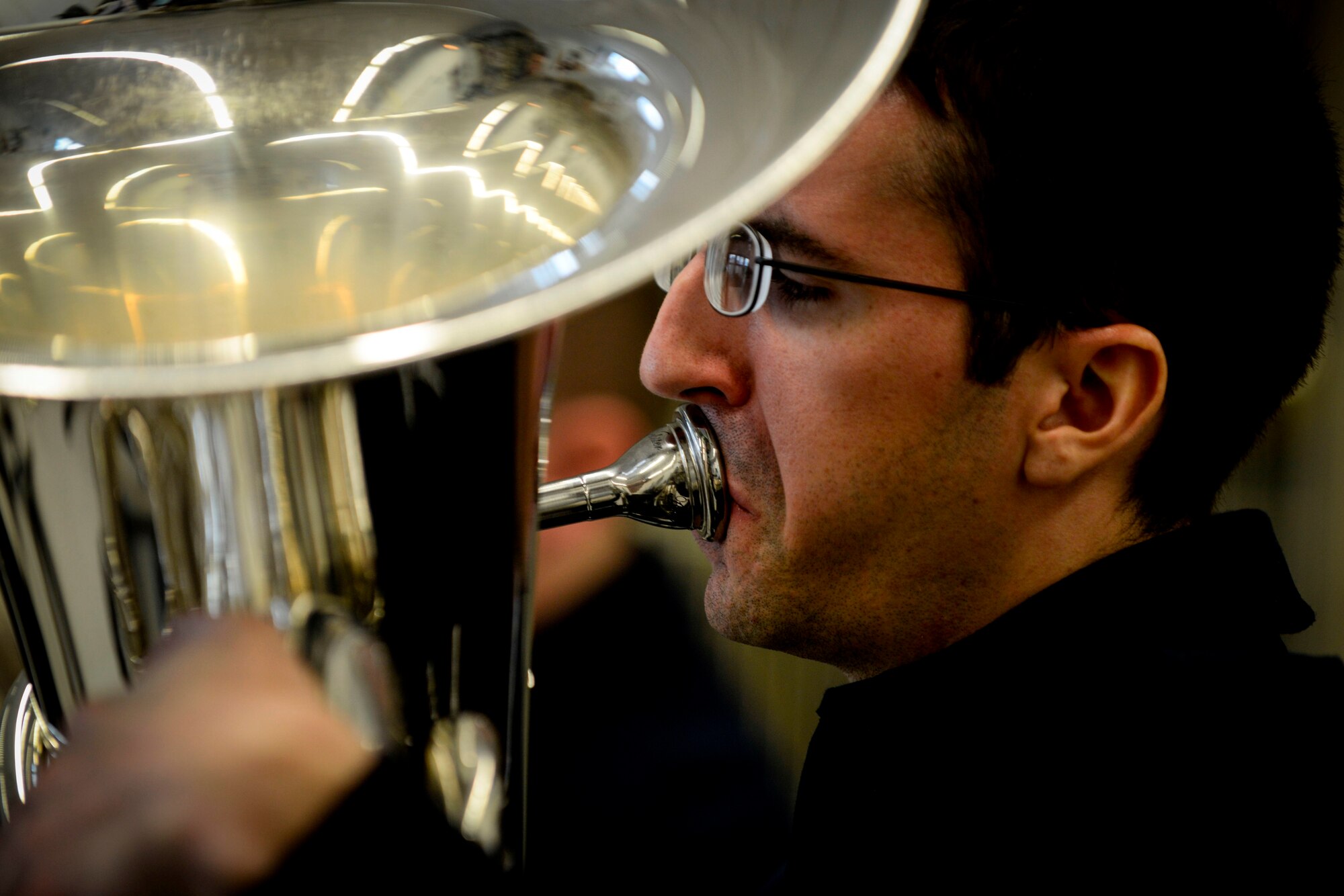 Senior Airman Colby Fahrenbacher, U.S. Air Forces in Europe Band’s Five Star Brass Quintet musician, performs for Kaiserslautern High School music students Nov. 5, 2015, on Vogelweh Military Complex.  The USAFE band’s mission includes educational outreach to increase involvement in the local community. (U.S Air Force photo/Senior Airman Nicole Sikorski) 