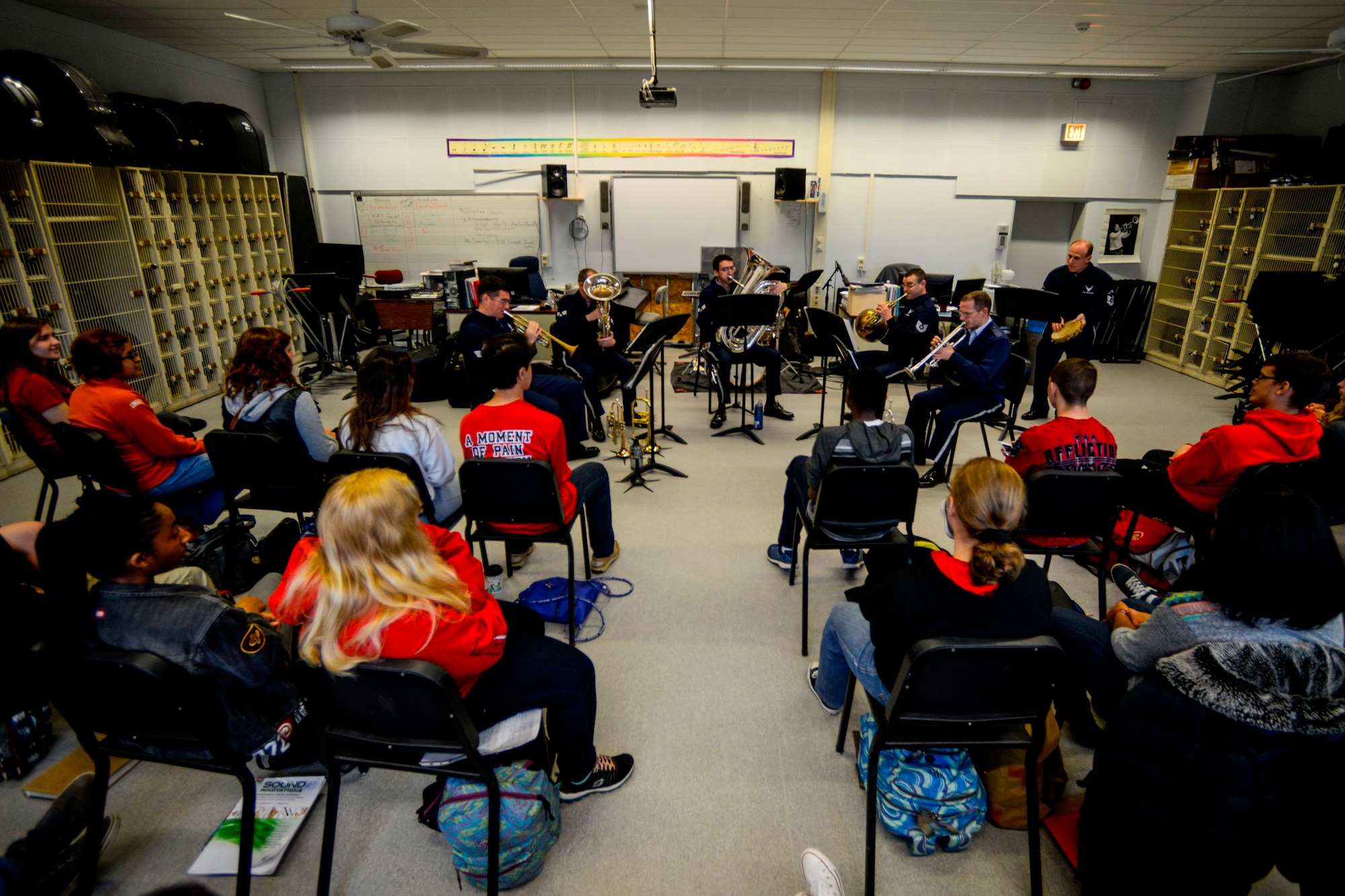 Kaiserslautern High School students listen to a performance by U.S. Air Forces in Europe Band’s Five Star Brass Quintet Nov. 5, 2015, on Vogelweh Military Complex. After their performance for the students, the quintet joined them in their rehearsal for their upcoming school concert.  (U.S Air Force photo/Senior Airman Nicole Sikorski)