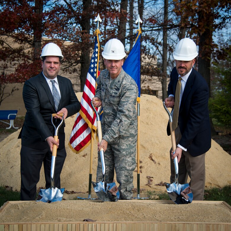 From left, Tony Pares, Army and Air Force Exchange Service Base Exchange general manager, Col. Brad Hoagland, 11th Wing and Joint Base Andrews commander, and Erick Kallas, Baggette Construction vice president, commemorate the start of the BX’s expansion and renovation with a ground breaking ceremony at Joint Base Andrews, Md., Nov. 17, 2015. The new facility is expected to be finished by fall 2017. (U.S. Air Force photo/Airman 1st Class Philip Bryant)