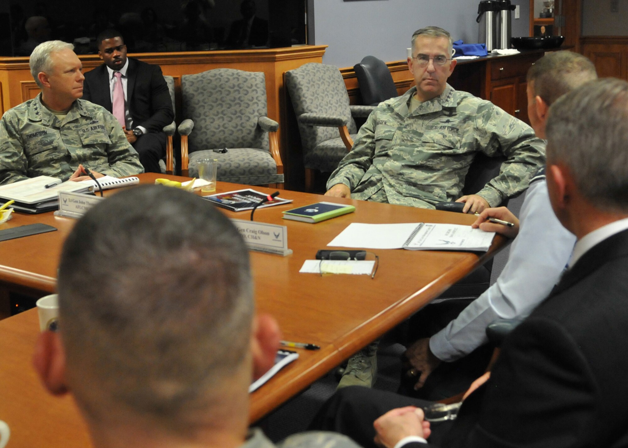 General John E. Hyten, commander of Air Force Space Command, center, is briefed by Maj. Gen. Craig Olson, C3I and Networks program executive officer, during a visit to Hanscom Air Force Base, Mass., Nov. 16, as Lt. Gen. John Thompson, left, commander of Air Force Life Cycle Management Center, and Scott Kiser, AFLCMC-Hanscom director of Contracting, right, look on. During his multi-day visit to the region, the general received briefings from Hanscom’s program executive officers, viewed a capabilities demonstration at the Hanscom Collaboration and Innovation Center, visited MIT Lincoln Laboratory and toured New Boston Air Force Station, N.H., and Cape Cod Air Force Station, Mass., both of which are Air Force Space Command assets. (U.S. Air Force photo by Linda LaBonte Britt)