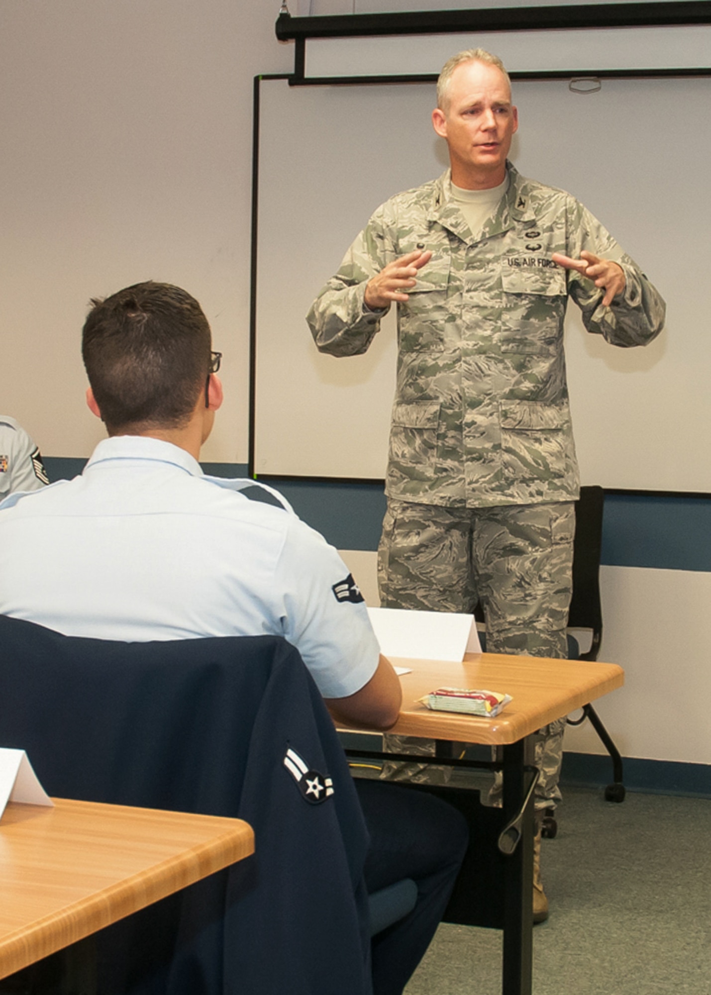 Col. Michael A. Vogel, 66th Air Base Group commander, speaks with Airmen attending the First Term Airman Center course at the Education and Training Center Nov. 16. The week-long course is designed to assist Airmen arriving at their first duty station in the Air Force. (U.S. Air Force photo by Walter Santos)