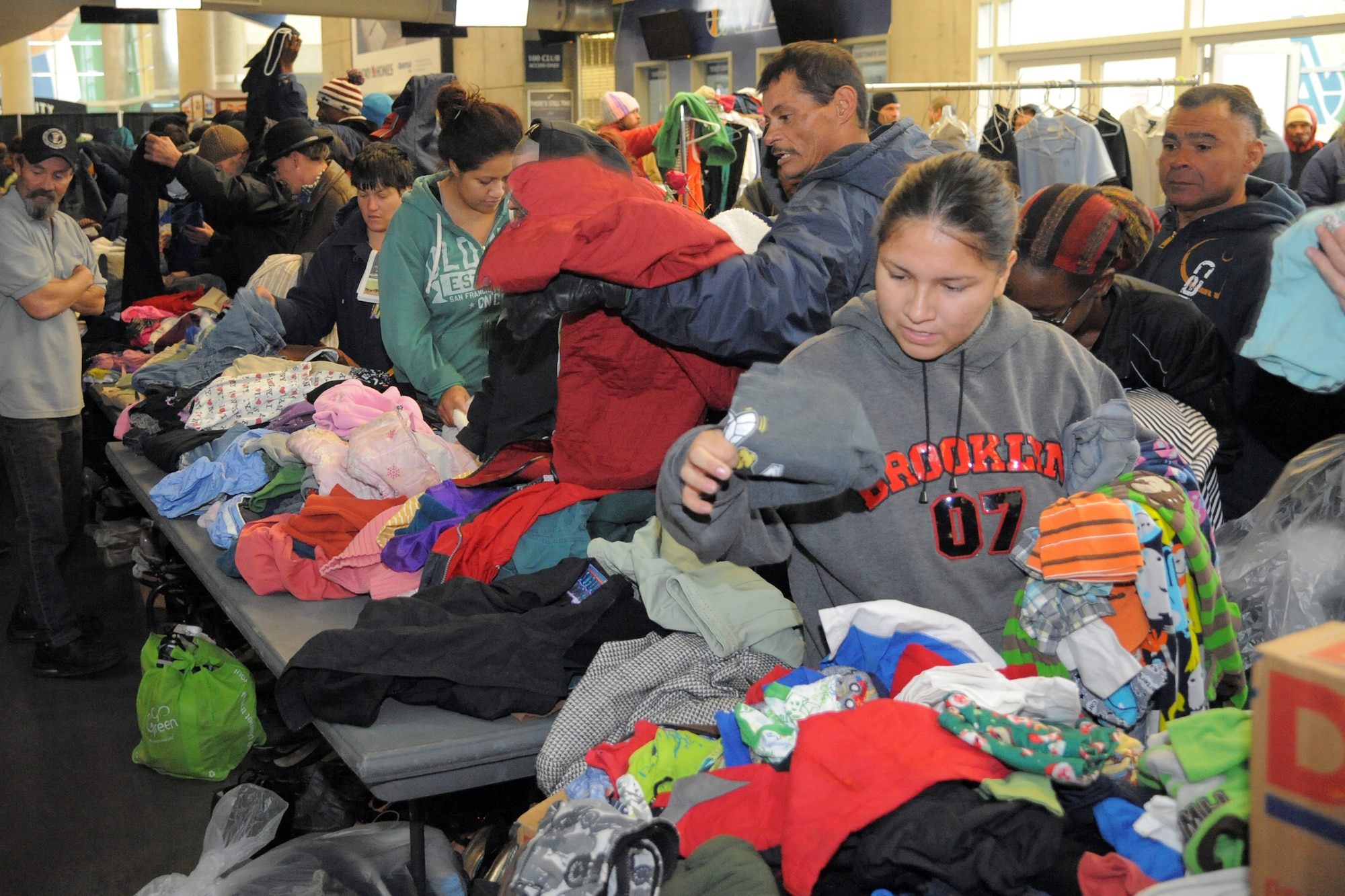 Utah residents receive donated winter clothing Nov. 16 at Vivint Smart Home Arena, Salt Lake City, Utah. The 17th annual community outreach event called We Care-We Share helped thousands in the greater Salt Lake City community. (U.S. Air Force photo by Todd Cromar)