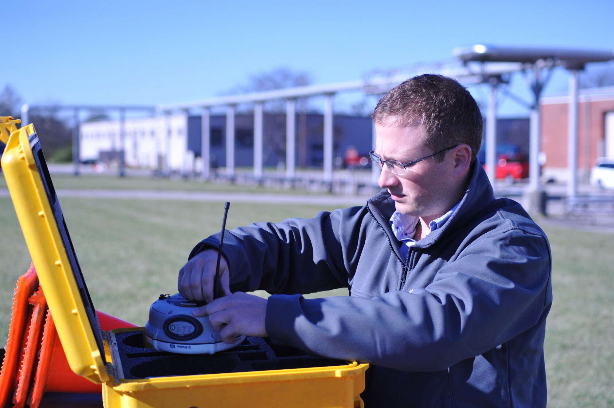 Jason Combs, an engineering technician and lead surveyor with the 88th Civil Engineering Group’s Record Drawings team prepares a Global Position System rover head to be mounted on a tri-pod before using the device to conduct a survey operation on Wright-Patterson Air Force Base. Data from the rover head is sent to a hand-held data collector after receiving information from at least four satellites orbiting the Earth ensuring accuracy of the information being recorded. (U.S. Air Force photo/Bryan Ripple)