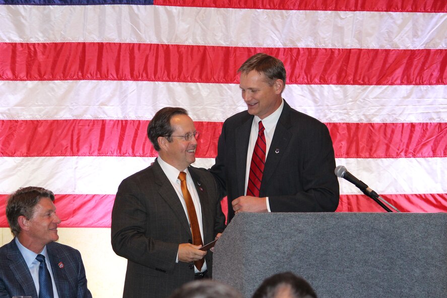 Outgoing ACC President, Jim Jolliffe, passes the gavel to the Incoming ACC President, Jim Herron, during the group’s annual banquet… the only fundraiser the group has. (U.S. Air Force photo/ Holly Fowler)