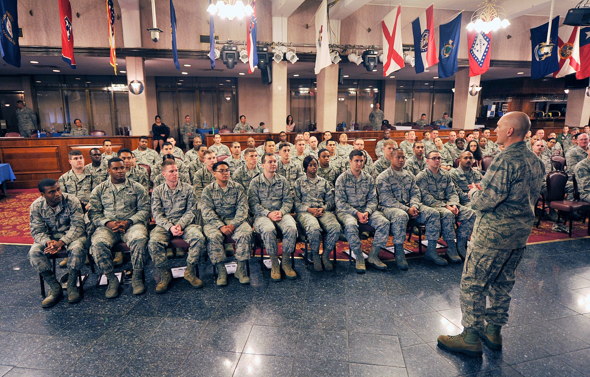 U.S. Air Force Col. John Cotton, 18th Aerospace Medicine Squadron commander, speaks to newly promoted staff sergeants during a quarterly NCO induction ceremony at the Rocker NCO Club, Nov. 16, 2015, at Kadena Air Base, Japan. The ceremony recognizes individuals who have attained the rank of staff sergeant, a milestone in their development in the Air Force. (U.S. Air Force photo by Naoto Anazawa)