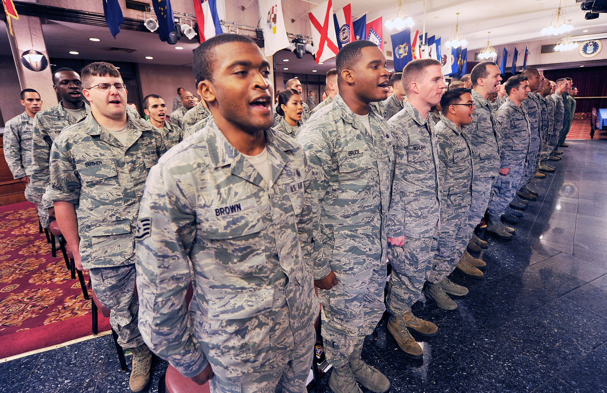 Newly promoted staff sergeants recite the Airman’s Creed during a quarterly NCO induction ceremony at the Rocker NCO Club, Nov. 16, 2015, at Kadena Air Base, Japan. The Airman's Creed helps establish a coherent bond between the members of the U.S. Air Force. The creed is fueled by the Air Force's heritage and, in the words of Moseley, the warfighting-focused culture, conviction, character, ethic, mindset, spirit and soul we foster in all Airmen. (U.S. Air Force photo by Naoto Anazawa)