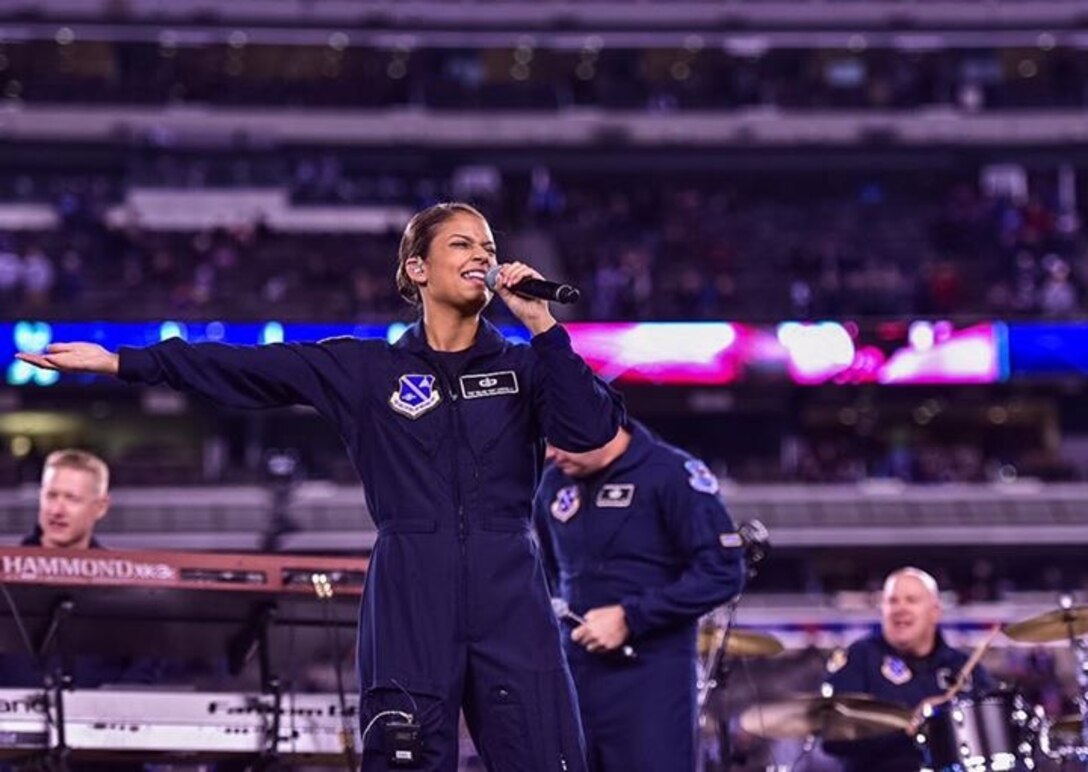 Technical Sergeant Nalani Quintello sings with The United States Air Force Band's Max Impact at MetLife Stadium for a special halftime performance at the New York Giants game against the New England Patriots. (U.S. Air Force Photo by Senior Master Sgt. Kevin Burns/released)