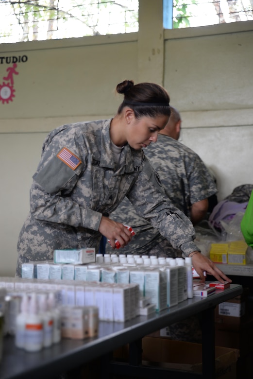 U.S. Army Sgt. Stephanie Tucker, Joint Task Force-Bravo radiologist technician, works in a stand-up pharmacy she augmented during a medical partnership exercise in the Olancho Department, Honduras, Nov. 14, 2015. Tucker is part of the medical element at Soto Cano Air Base and also participated in a medical readiness training exercise the two previous days. (U.S. Air Force Photo by Senior Airman Westin Warburton/Released)