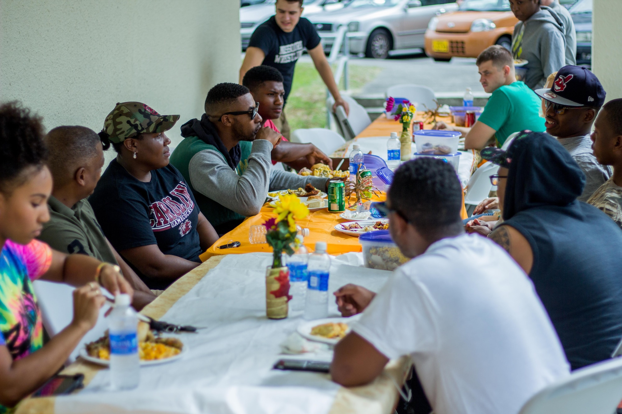 Members of the 353rd Special Operations Group come together during a Thanksgiving Dinner Nov. 14 on Kadena Air Base, Japan.  The 353rd Special Operations Group hosted the dinner for all SOG single Airmen and dorm residents.  More than 100 dishes were donated and nearly 100 Airmen to come together and enjoy the holiday dinner. (U.S. Air Force photo by Senior Airman Bobby Jackson) 