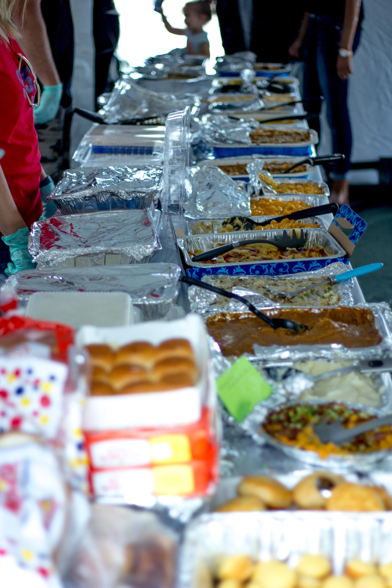 Dishes donated by Pacific Air Commandos line the tables during a Thanksgiving Dinner Nov. 14 on Kadena Air Base, Japan.  The 353rd Special Operations Group hosted the dinner for all SOG single Airmen and dorm residents.  More than 100 dishes were donated and nearly 100 Airmen to come together and enjoy the holiday dinner. (U.S. Air Force photo by Senior Airman Bobby Jackson) 