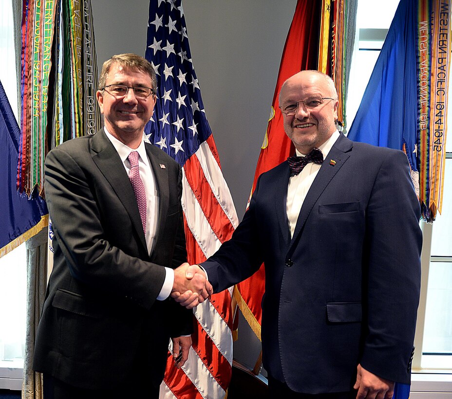 U.S. Defense Secretary Ash Carter, left, and Lithuanian Defense Minister Juozas Olekas shake hands during a meeting at the Pentagon, Nov. 17, 2015. DoD photo by Army Sgt. 1st Class Clydell Kinchen