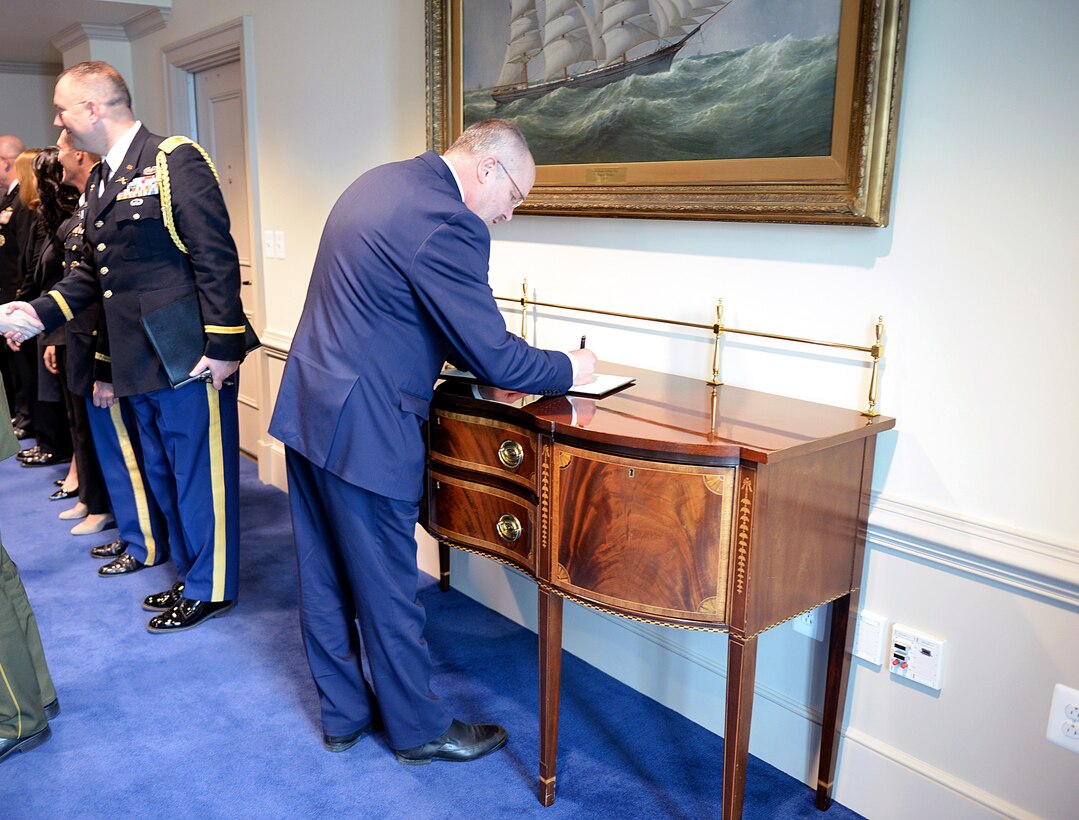 Lithuanian Defense Minister Juozas Olekas signs a guest book before meeting with U.S. Defense Secretary Ash Carter at the Pentagon, Nov. 17, 2015. DoD photo by Army Sgt. 1st Class Clydell Kinchen