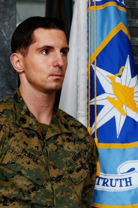 Marine Sgt. Marcin J. Platek, an instructor at the Defense Information School at Fort Meade, Md., stands in the Hall of Heroes at DINFOS on Nov. 9, 2015. Platek recently was chosen as the  school's 2015 Warrior of the Year for his outstanding contributions as an instructor at DINFOS and as a mentor to junior Marines.