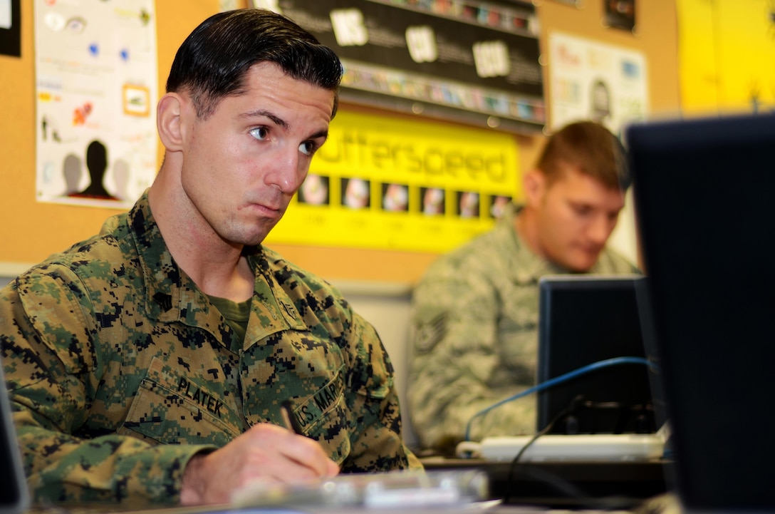 Marine Sgt. Marcin J. Platek, an instructor at the Defense Information School at Fort Meade, Md., attends a Broadcast Management Course class at DINFOS on Nov. 9, 2015. In preparation for teaching the course, he is taking it for credit.
