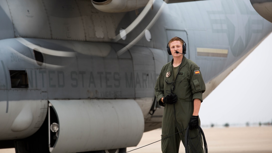 Sgt. Hayden Frank, a crew master with Special-Purpose Marine Air-Ground Task Force Crisis Response-Africa, performs final checks before departure on a KC-130J Hercules in Zaragoza, Spain, Nov. 1, 2015. The Marines spent a week training with Spanish counterparts, providing air delivery of gear and personnel, Nov. 9-13. 