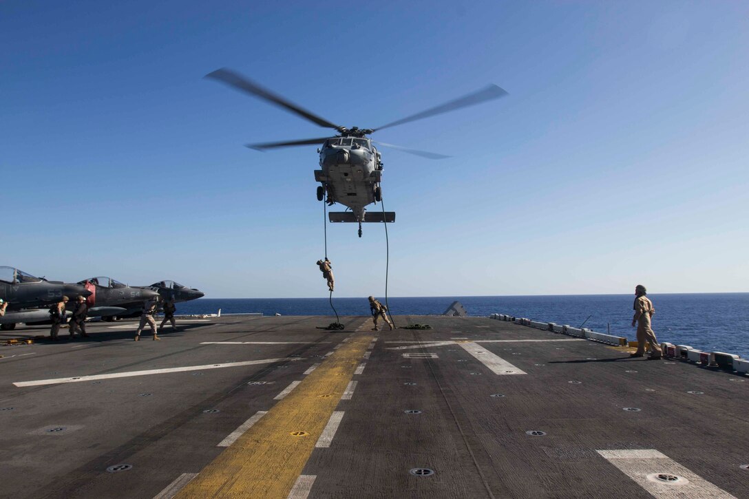U.S. Marines conduct fast-rope training out of a SH-60 Seahawk helicopter aboard the amphibious assault ship USS Kearsarge in the North Red Sea, Nov. 5, 2015. U.S. Marine Corps photo by Cpl. Jalen D. Phillips