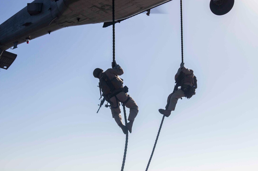 U.S. Marines conduct fast-rope training out of a SH-60 Seahawk helicopter aboard the amphibious assault ship USS Kearsarge in the North Red Sea, Nov. 5, 2015. U.S. Marine Corps photo by Cpl. Jalen D. Phillips 