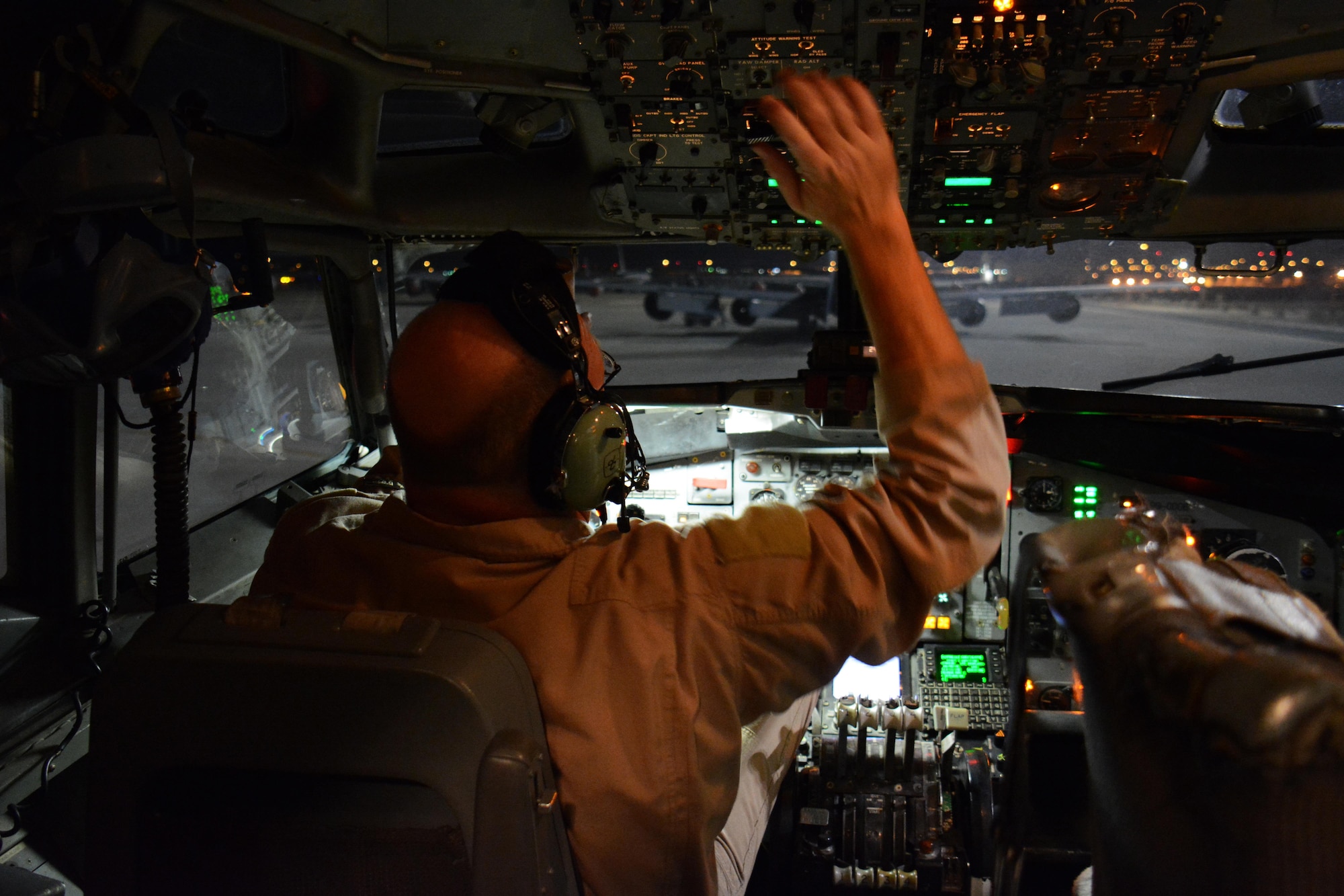 Master Sgt. Curtis Stark, 7th Expeditionary Air Combat Control Squadron superintendent, conducts a pre-flight inspection in the cockpit of an E-8C Joint Surveillance Target Attack Radar System aircraft at Al Udeid Air Base, Qatar Nov. 14. Stark has deployed 17 times with JSTAR aircraft in support of contingency operations and has accumulated more than 4,000 combat flying hours. After nearly 30 years of service he plans to retire from the Air Force in March 2016. (U.S. Air Force photo by Tech. Sgt. James Hodgman/Released)