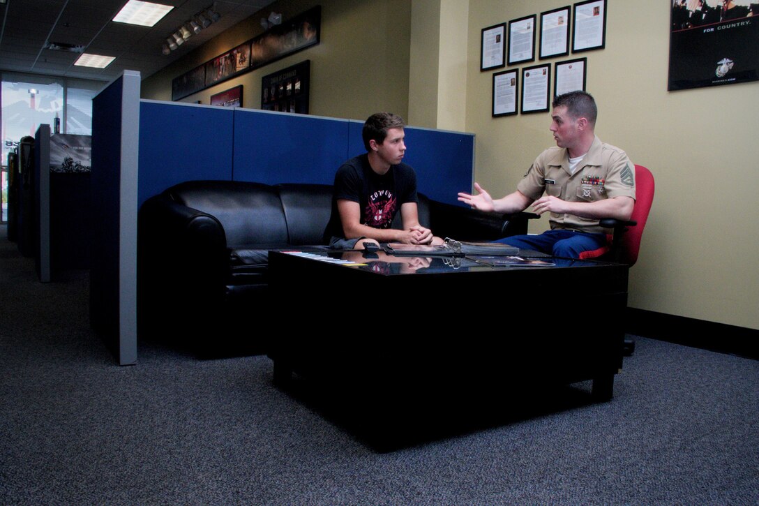 Marine Corps recruiter Staff Sgt. Christopher Giannetti, with Recruiting Substation Naples, Recruiting Station Fort Lauderdale, Fla., speaks with a prospective Marine about opportunities and benefits during a follow up interview June 12, 2013. Giannetti has made 15 Marines during his time as a canvasing recruiter, two of which became platoon honor graduates during boot camp. 