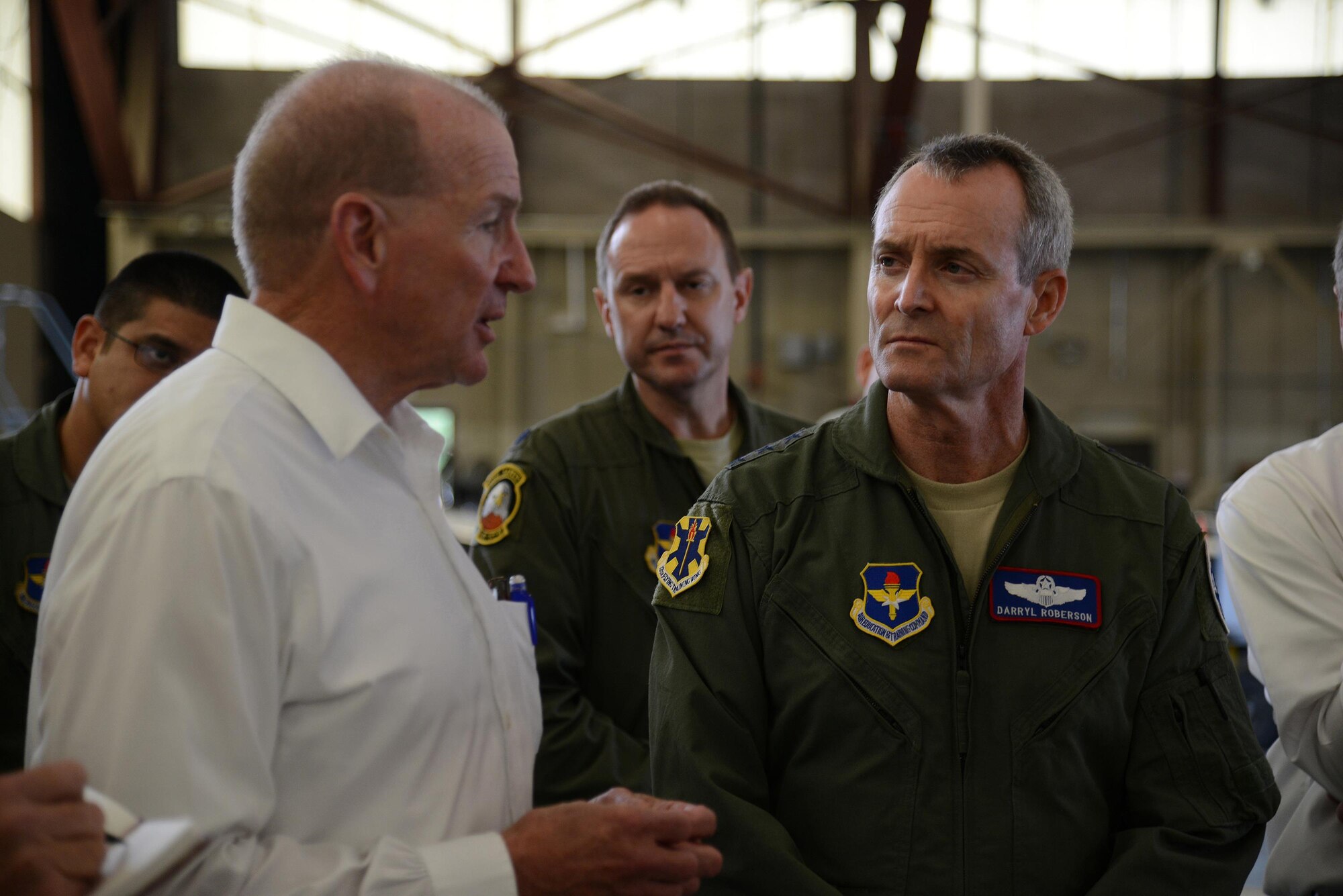 James Kelly, 47th Maintenance Directorate director of Maintenance, speaks to Lt. Gen. Darryl Roberson, commander of Air Education and Training Command, during the general’s tour of Laughlin Air Force Base, Texas, Nov. 16, 2015. While at Laughlin, Roberson toured the T-6A Texan II aircraft hangar to discuss and observe maintenance operations. (U.S. Air Force photo by Airman 1st Class Ariel D. Partlow)