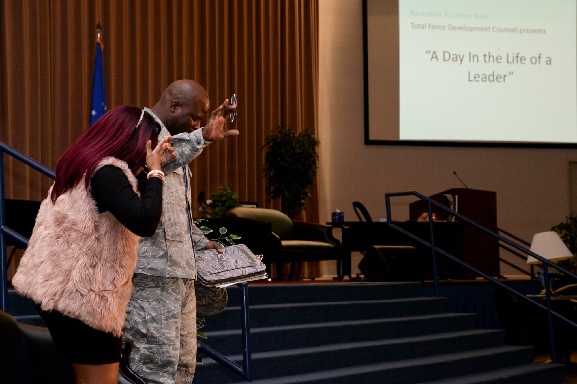 Senior Airman Karin Puckett and Staff Sgt. Charlton Nelson, Barksdale Sexual Assault Theater Group actors, perform during the theatrical play “A Day in the Life of a Leader” at Barksdale Air Force Base, La., Nov. 13, 2015. The event was hosted by the Barksdale Total Force Development Council to enhance leadership, management and supervisory skills as well as raise awareness about helping agencies. (U.S. Air Force photo/ Senior Airman Jannelle Dickey) 