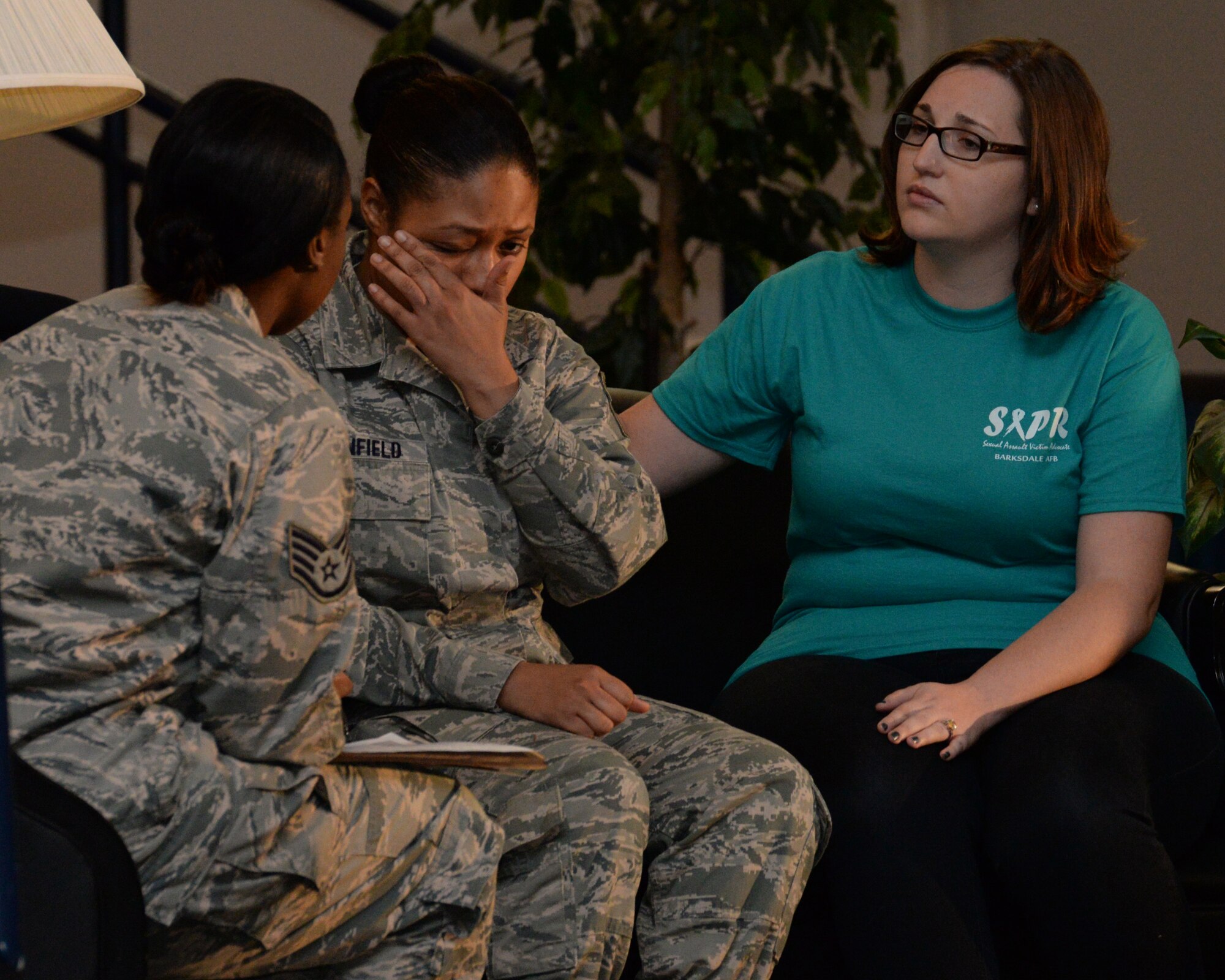 Amanda Joakey, right to left, Staff Sgts. Erica Hood and Porshae McMillan, Barksdale Sexual Assault Theater Group actors perform during the theatrical play “A Day in the Life of a Leader” at Barksdale Air Force Base, La., Nov. 13, 2015. The SATG is an integral component of the sexual assault prevention and response program. (U.S. Air Force photo/ Senior Airman Jannelle Dickey)