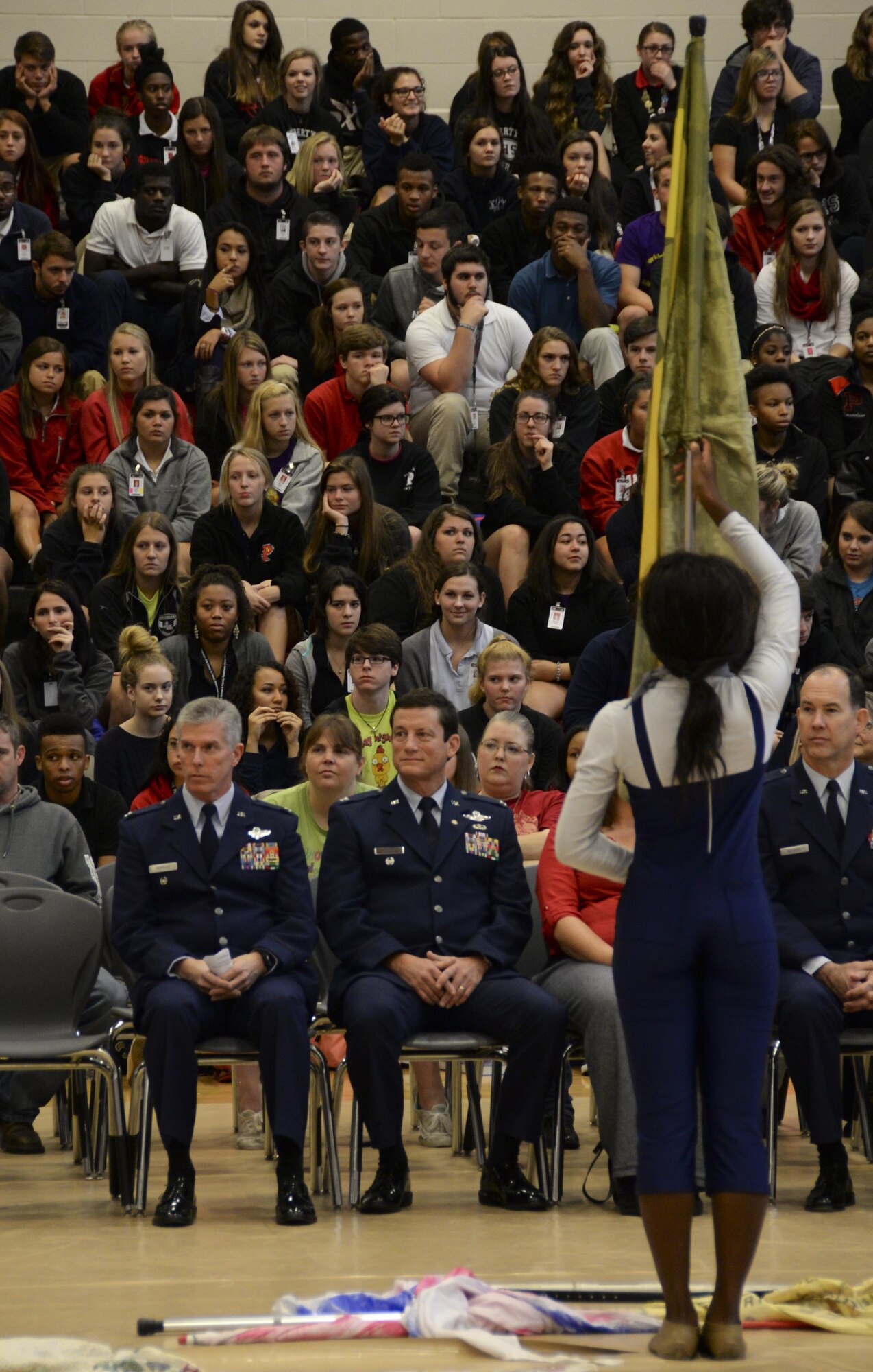 Col. Trey Morriss, retired Col. Russ Mathers and retired Col. Warren Ward, 596th Bomb Squadron Airmen who participated in Operation Senior Surprise, watch a dance line performance during an annual Veterans Day Tattoo Ceremony at Parkway High School in Bossier City, La., Nov. 11, 2015. Operation Senior Surprise was a clandestine mission that helped kick off Operation Desert Storm. Students gave multiple performances during the tattoo including drum corps, band, choir, dance line and service medley. (U.S. Air Force photo/Senior Airman Amanda Morris) 