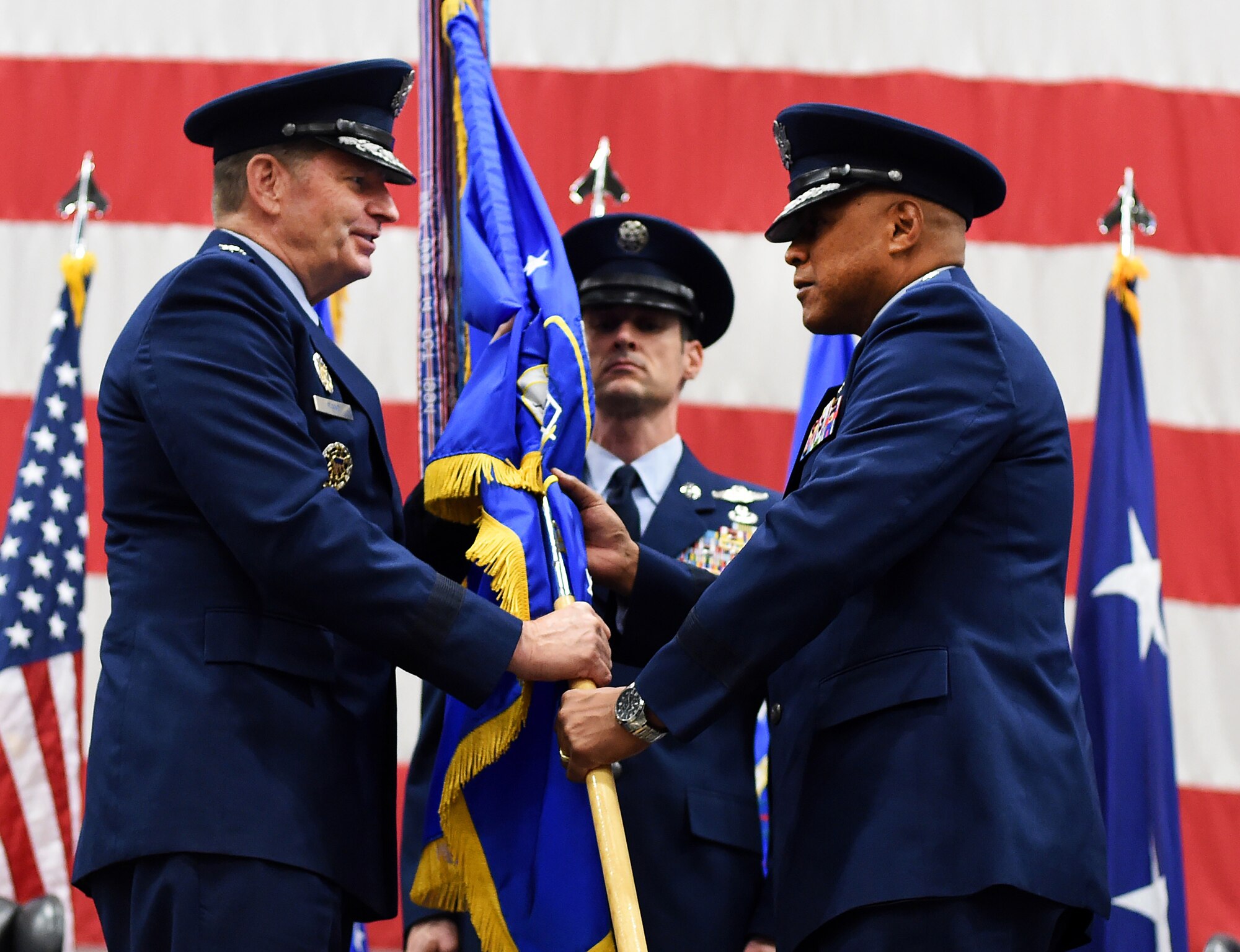 Gen. Robin Rand, Air Force Global Strike Command commander, presents the 20th Air Force guidon to Maj. Gen. Anthony J. Cotton as Cotton takes command of the numbered air force responsible for the nation's three intercontinental ballistic missile wings and one nuclear operations support wing on F.E. Warren Air Force Base, Nov. 16, 2015. Cotton also took command of Task Force 214 from Adm. Cecil D. Haney, U.S. Strategic Command commander, during the same ceremony.  Twentieth Air Force prepares the nation's ICBM forces to execute safe, secure and effective nuclear strike operations and supports worldwide combatant commander requirements. (U.S. Air Force photo by R.J. Oriez/Released)