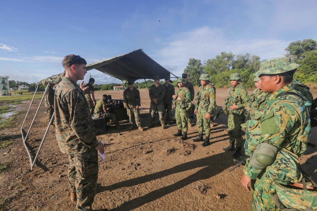 TUTONG, Brunei  (Nov. 11, 2015) U.S. Marine Cpl. Michael Katra shares the capabilities of the Raven small unmanned aerial vehicle with soldiers with the Royal Brunei Land Force during Combined Afloat Readiness and Training - Brunei 2015. Katra is an intelligence specialist with Battalion Landing Team 3rd Battalion, 1st Marine Regiment, 15th Marine Expeditionary Unit. Elements of the 15th MEU Marines are ashore in Brunei to perform day and night training in an urban environment and to enhance interoperability and partnership between the U.S. and Brunei. The 15th MEU is currently deployed in the Indo-Asia-Pacific region to promote regional stability and security in the U.S. 7th Fleet area of operations. (U.S. Marine Corps photo by Sgt. Jamean Berry/Released)