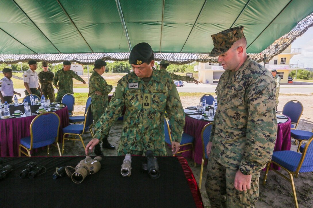 TUTONG, Brunei  (Nov. 11, 2015) U.S. Marine Capt. Kyle Kurtz, right, shows Brunei Land Force Brig. Gen. Pengiran Dato Seri Pahlawan Aminan Bin Pengiran Haji Mahmud different types of night vision and thermal imaging devices during Combined Afloat Readiness and Training - Brunei 2015.  Kurtz is the commanding officer of India Company, Battalion Landing Team 3rd Battalion, 1st Marine Regiment, 15th Marine Expeditionary Unit. Brig. Gen. Aminan is the Chief of the Army for the Royal Brunei Land Force. Elements of the 15th MEU Marines are ashore in Brunei to perform day and night training in an urban environment and to enhance interoperability and partnership between the U.S. and Brunei. The 15th MEU is currently deployed in the Indo-Asia-Pacific region to promote regional stability and security in the U.S. 7th Fleet area of operations. (U.S. Marine Corps photo by Sgt. Jamean Berry/Released)