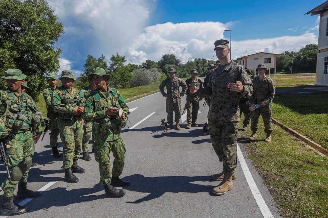 TUTONG, Brunei  (Nov. 11, 2015) U.S. Marine Staff Sgt. James Leach, right, instructs U.S. Marines and Soldiers with the Royal Brunei Land Force on vehicle control point procedures during Combined Afloat Readiness and Training - Brunei 2015. Leach is a platoon sergeant with Battalion Landing Team 3rd Battalion, 1st Marine Regiment, 15th Marine Expeditionary Unit. Elements of the 15th MEU Marines are ashore in Brunei to perform day and night training in an urban environment and to enhance interoperability and partnership between the U.S. and Brunei. The 15th MEU is currently deployed in the Indo-Asia-Pacific region to promote regional stability and security in the U.S. 7th Fleet area of operations. (U.S. Marine Corps photo by Sgt. Jamean Berry/Released)