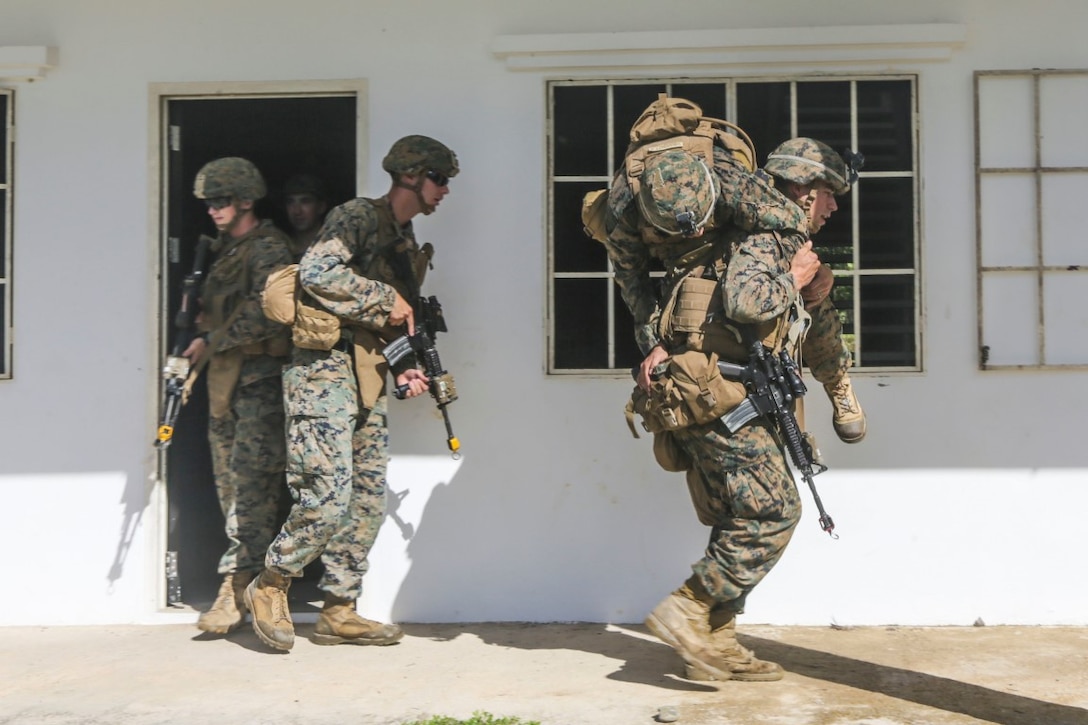 TUTONG, Brunei  (Nov. 11, 2015) U.S. Marines with India Company, Battalion Landing Team 3rd Battalion, 1st Marine Regiment , 15th Marine Expeditionary Unit, practice extracting a simulated casualty during Combined Afloat Readiness and Training 2015. Elements of the 15th MEU Marines are ashore in Brunei to perform day and night training in an urban environment and to enhance interoperability and partnership between the U.S. and Brunei. The 15th MEU is currently deployed in the Indo-Asia-Pacific region to promote regional stability and security in the U.S. 7th Fleet area of operations. (U.S. Marine Corps photo by Sgt. Jamean Berry/Released)