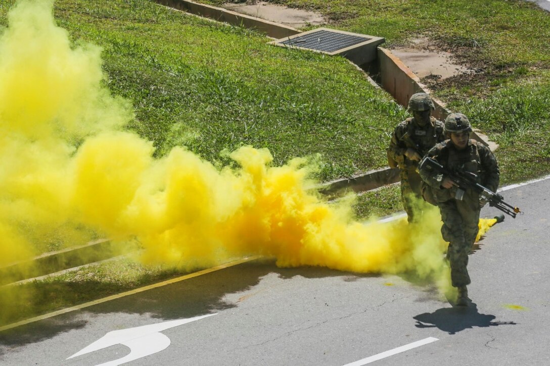 TUTONG, Brunei (Nov. 11, 2015)   U.S. Marines with India Company, Battalion Landing Team 3rd Battalion, 1st Marine Regiment, 15th Marine Expeditionary Unit, run through smoke concealment during Combined Afloat Readiness and Training - Brunei 2015. Elements of the 15th MEU Marines are ashore in Brunei to perform day and night training in an urban environment and to enhance interoperability and partnership between the U.S. and Brunei. The 15th MEU is currently deployed in the Indo-Asia-Pacific region to promote regional stability and security in the U.S. 7th Fleet area of operations. (U.S. Marine Corps photo by Sgt. Jamean Berry/Released)