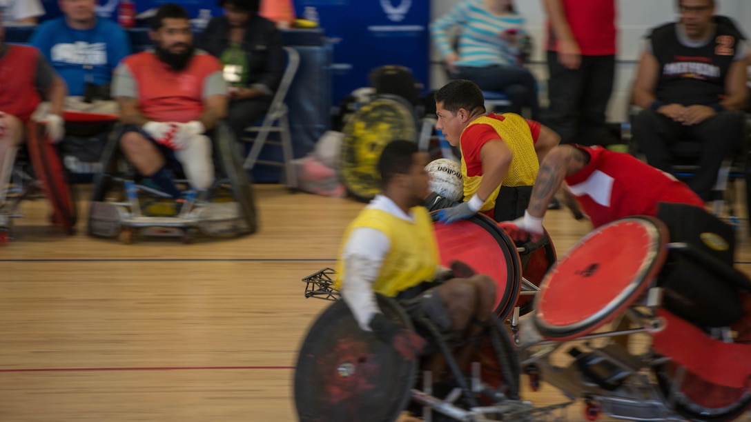 Service members participated in the Joint Service Wheelchair Rugby Exhibition at the West Fitness Center on Joint Base Andrews, Md., as part of Warrior Care Month, Nov. 16, 2015. The exhibition started with a demonstration match between two professional wheelchair rugby teams. Following the opening match, service members from the Marine Corps, Air Force and Army were divided into four teams: Big Red, Bruisers, Cherry Pickas, and Spartans. The Cherry Pickas won the one-day exhibition tournament.