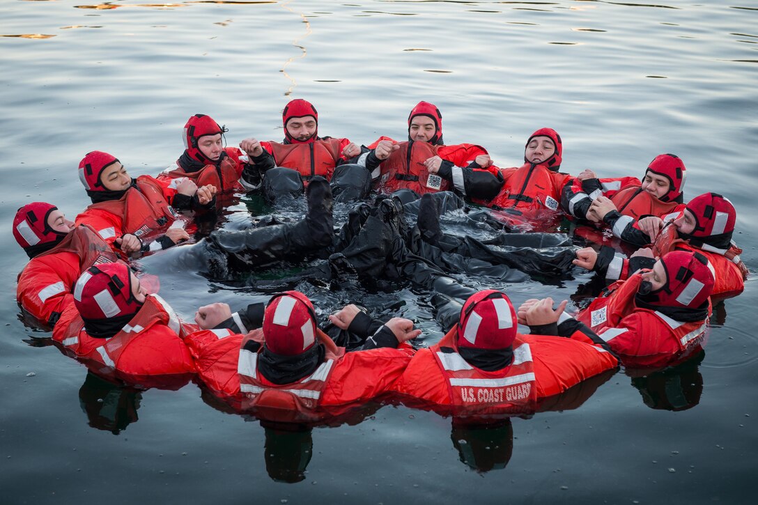 Coast Guardsmen test their survival suits for leaks in Boston Harbor, Nov. 18, 2015. The Coast Guardsmen, assigned to the Coast Guard Cutter Spencer, were preparing for winter as temperatures dropped throughout New England. U.S. Coast Guard photo by Petty Officer 3rd Class Ross Ruddell