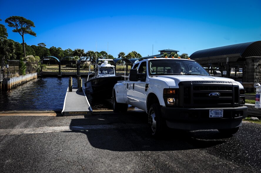Maritime operation members launch a boat before Maritime Craft Aerial Delivery Systems (MCADS) training at Hurlburt Field, Fla., Nov. 12, 2015. MCADS enable special operation forces members to rapidly deploy anywhere around the world in a maritime environment. (U.S. Air Force photo by Senior Airman Meagan Schutter)
