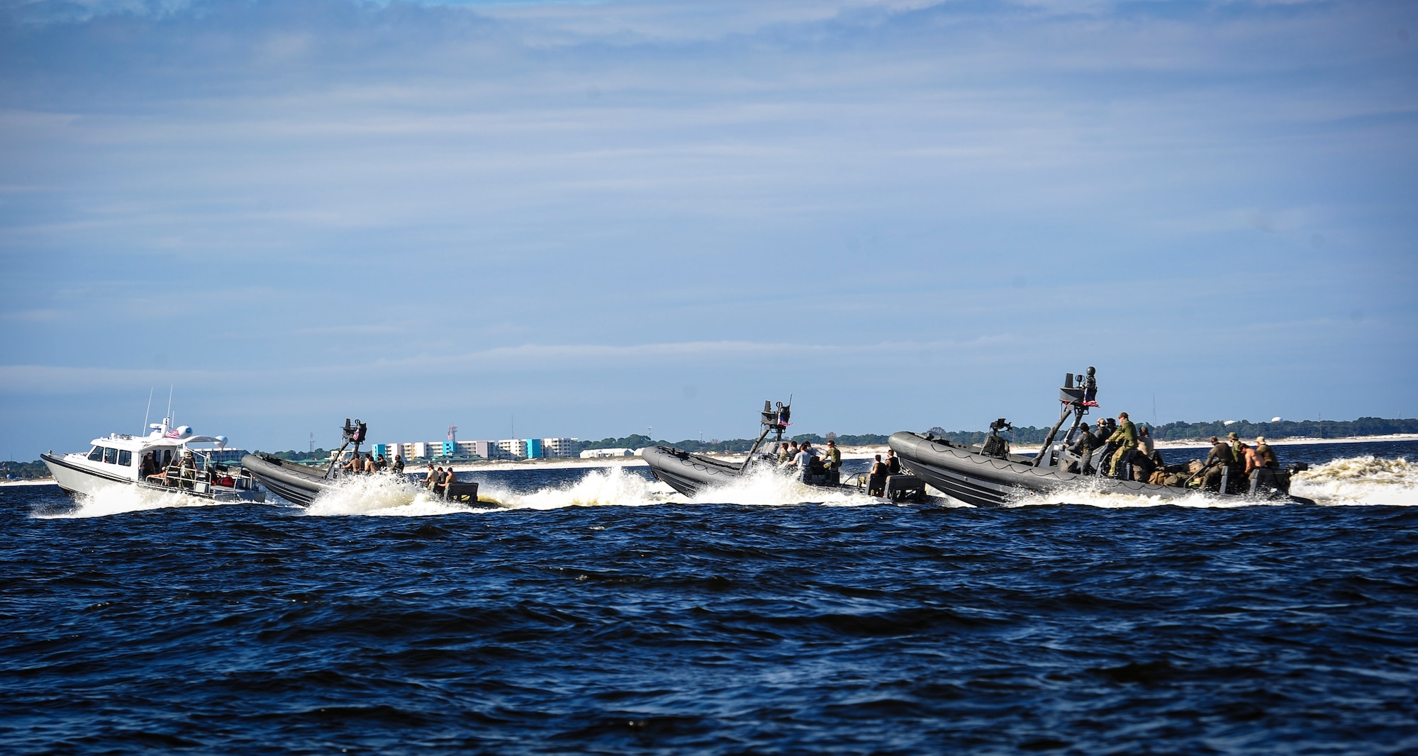Special operation forces and maritime operation members travel to the Gulf of Mexico to retrieve a rigid inflatable boat for Maritime Craft Aerial Delivery Systems (MCADS) training, Nov. 12, 2015. MCADS enable special operation forces members to rapidly deploy anywhere around the world in a maritime environment. (U.S. Air Force photo by Senior Airman Meagan Schutter)