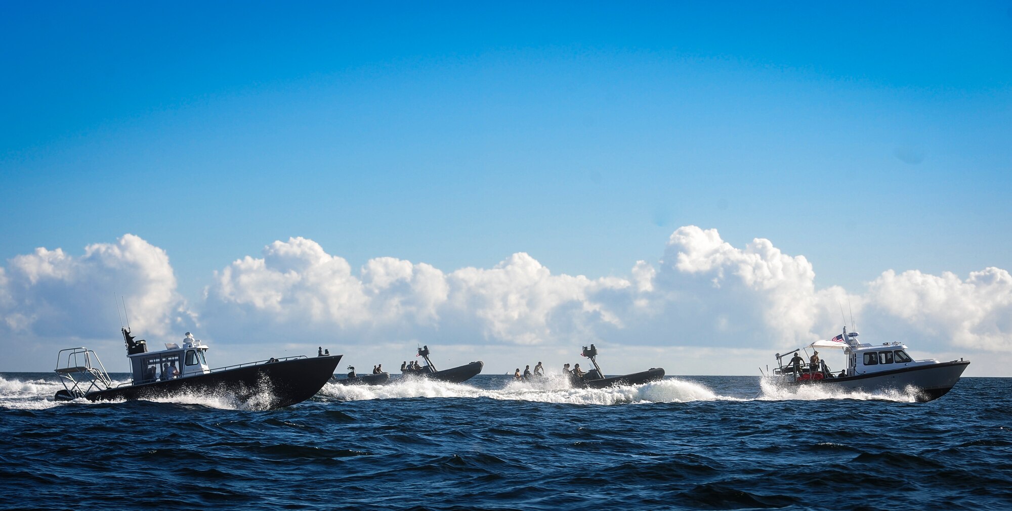 Special operation forces and maritime operation members travel to the Gulf of Mexico to retrieve a rigid inflatable boat during Maritime Craft Aerial Delivery Systems (MCADS) training, Nov. 12, 2015. MCADS enable special operation forces members to rapidly deploy anywhere around the world in a maritime environment. (U.S. Air Force photo by Senior Airman Meagan Schutter)